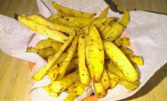 The finished potatoes can be transferred to a napkin to remove excess oil.