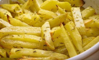 Crispy French fries are ready in the oven. Serve and enjoy!