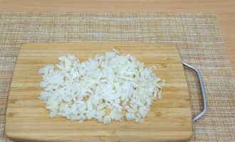 Peel a small head of white onion from dry skins, wash and chop very finely.