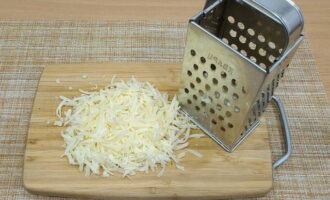 Grate a small piece of hard cheese on a grater with large holes or cut into very small cubes.