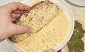 Roll the browned tenderloin in breadcrumbs.