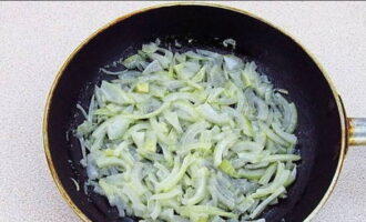 Sauté the onion in hot butter.