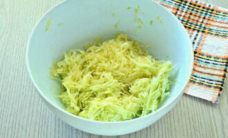 Grate these vegetables using a medium grater and immediately into the dough bowl.