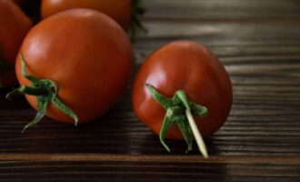 We pierce each tomato with a toothpick in place of the stalk.