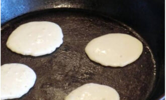 Heat a frying pan well with vegetable oil.Place the dough into it in portions using a tablespoon.