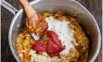 After the specified time, add mayonnaise, tomato paste, apple cider vinegar, sugar and salt to the vegetables. Simmer for another 30 minutes, stirring occasionally.