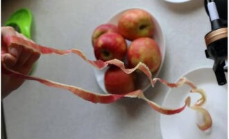 We wash the apples and peel them.