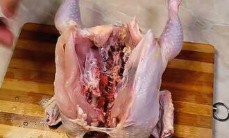 Carefully separate the bird with your hands and wash it from the inside.