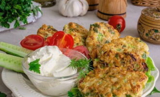 Cutlets made from zucchini and minced meat in a frying pan are ready. Serve to the table!