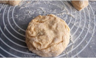 Cover the filling with a small piece of dough, rolled out into a circle, and seal the edges.