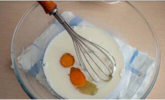 Beat in the eggs and beat with a whisk.