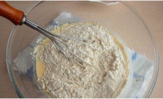 Add ½ part of the flour and mix thoroughly.