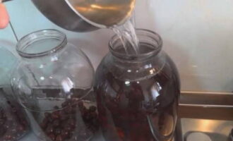 Boil clean water. Place the prepared cherries in jars, fill them completely with boiling water and, covering the jars with lids, leave for 20 minutes.