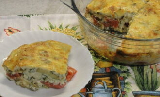 Eggplant casserole with cheese and tomatoes in the oven is ready. Help yourself!