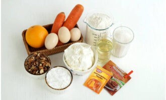 Classic carrot cake is easy to make at home. Prepare the ingredients. Sour cream must be full-fat, ideally homemade. Preheat the oven to 180°C.