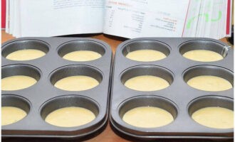 Pour the dough into molds. Fill them about 2/3 full.