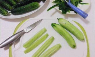 Use a vegetable peeler to carefully remove the peel. Using a sharp knife, remove the ends and cut each cucumber into 4 longitudinal slices.