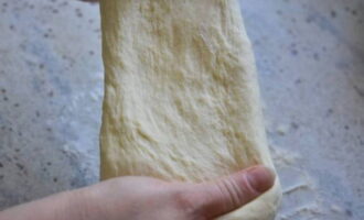 Take the soft and elastic product out of the bowl.You can knead it a little with your hands.