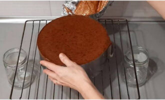 Turn the baked sponge cake upside down onto a wire rack and cool slightly.