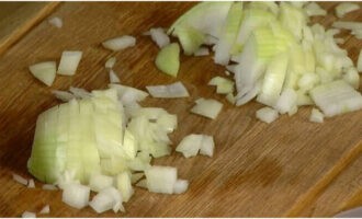 Peel both onions and finely chop.