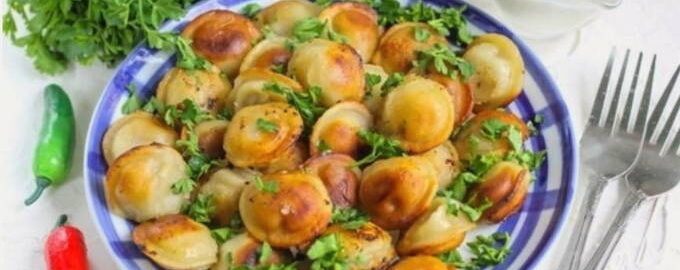 Fried dumplings in a frying pan