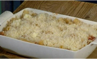 Grate the hard cheese on a fine grater and sprinkle the shavings over the workpiece.