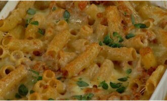 Place the pan in the oven and bake for 15 minutes. Pasta casserole in the oven is ready! Garnish the finished casserole with basil leaves and serve warm. Bon appetit!