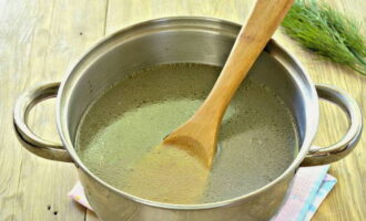 Transfer the boiled bird to a plate, cool, and disassemble into pieces.Return the broth to the burner and add salt.