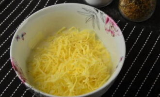 Add grated cheese, salt and ground pepper and mix well.