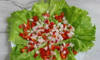 Sprinkle the greens with pepper and radish trimmings.