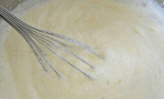 Using light hand movements, combine the whites with the cheese mixture.