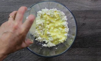 Pour the egg mixture evenly over the surface of the cottage cheese.